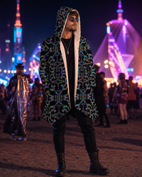 Prismatic Grid Micro Fleece Cloak, Hooded Wearable Art, Psychedelic Festival Layer — wearer-right three-quarter — hood lowered