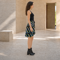 Phonetic Vortex Wrap Skirt — wearer-right profile lifestyle view