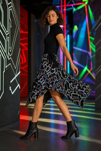 Prismatic Grid Wrap Skirt — wearer-left profile lifestyle view