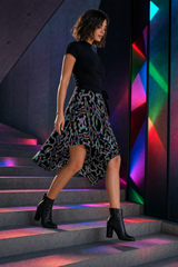 Prismatic Grid Wrap Skirt — wearer-right profile lifestyle view